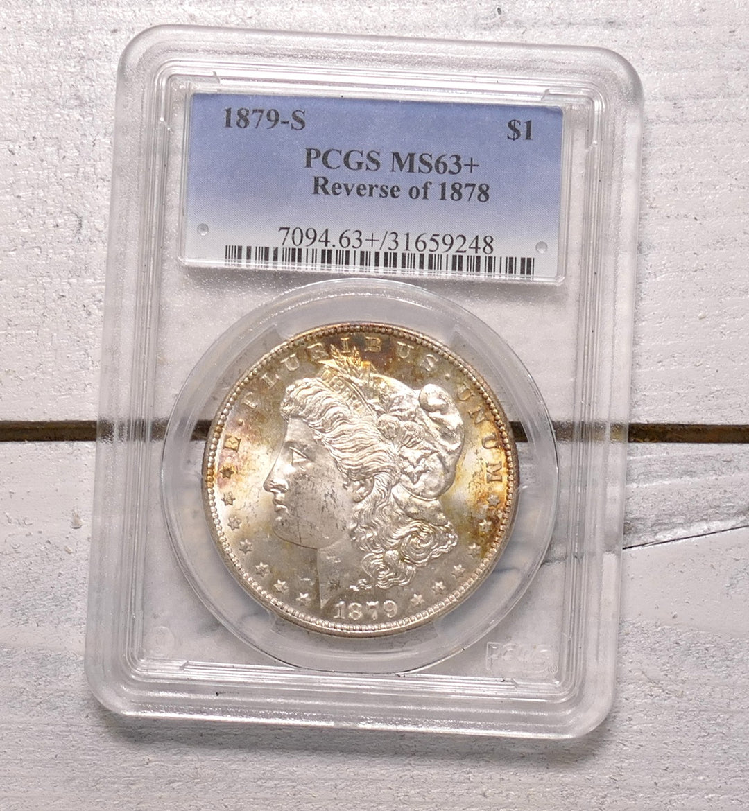 US 1879 REVERSE OF A 1878 MORGAN DOLLAR S MINT MS63+