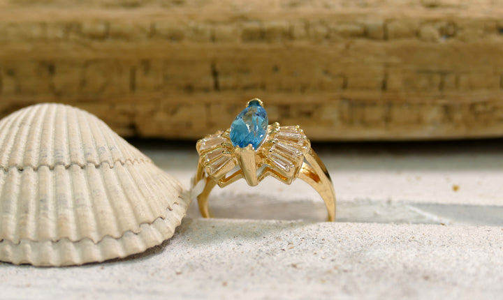14k Yellow Gold Blue Topaz Ballerina with 10 Baguette Diamonds Ring