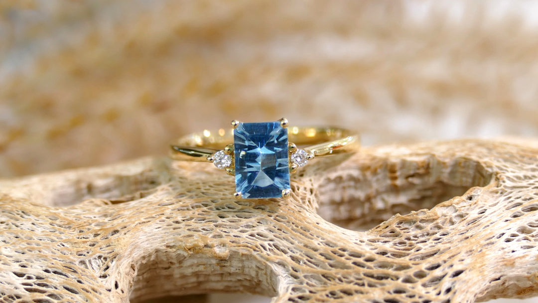 14k Yellow Gold Blue Topaz Emerald Cut Ring (Size 7)