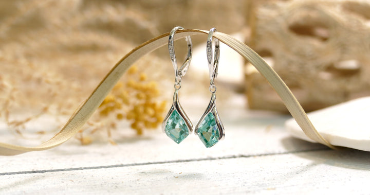 14k White Gold 4.1ct Caribbean Topaz Dangle Earrings